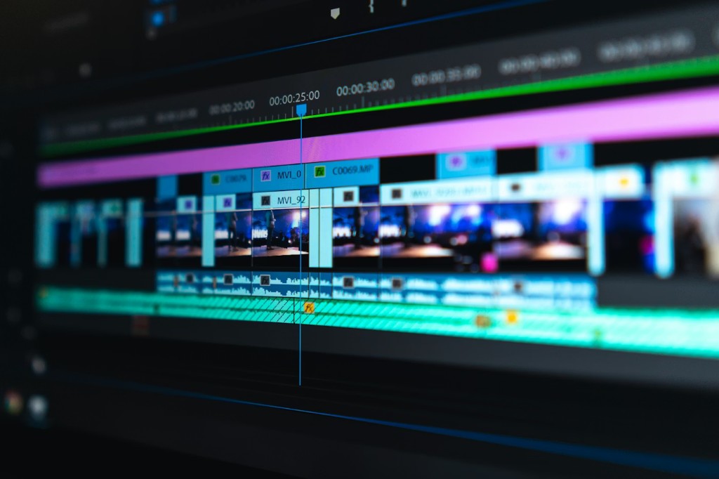 Video editor working on a timeline with motion graphics and color grading